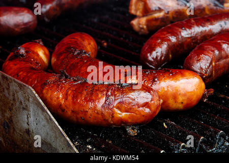 Bratwurst sausages on cast iron griddle. Stock Photo