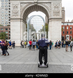 New York, NY 14 October 2017 - Man on a Segway style personal transportation device views Ai Weiwei's sculptural installation in Washington Square Park, in Greenwich Village CREDIT ©Stacy Walsh Rosenstock Stock Photo