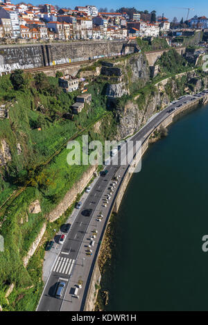 Closed Ramal da Alfandega railway line and Paiva Couceiro Avenue over Douro River in Porto city,  Portugal. View from Infante D. Henrique Bridge Stock Photo