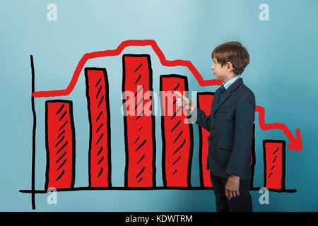 Teen boy businessman points his finger at businessman chart cris Stock Photo