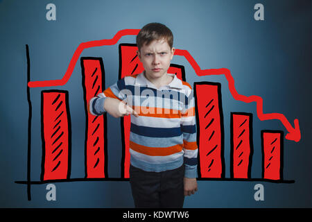 Teen boy points his finger down frowning businessman chart crisi Stock Photo