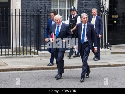 Boris Johnson MP, Secretary of State for Foreign Affairs, (L) and Philip Hammond MP  the British Chancellor of the Exchequer, (R) leaving a 2.5 hour c Stock Photo