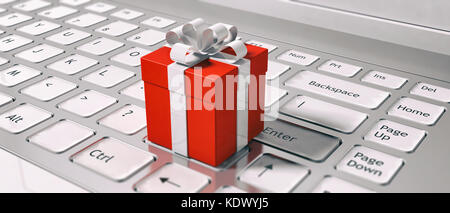 Buying gifts online. Keyboard and red gift box closeup. E-commerce on holidays concept. 3d illustration Stock Photo