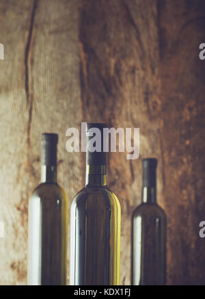 Wine. Glass of white wine in wine cellar. Old white wine on wood. Stock Photo