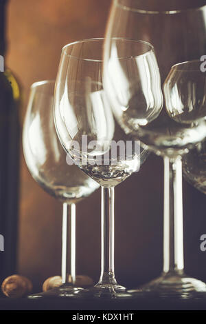 Wine. Empty wine glass. in wine cellar. Old white wine on wood.Arranged wine glasses Stock Photo