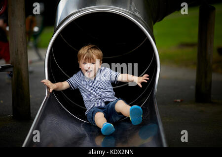 Pennines village, Haworth in West Yorkshire, England. William Waugh playing in Central Park Stock Photo