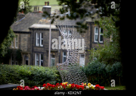 Pennines village, Haworth in West Yorkshire, England. statue artwork  in Central Park Stock Photo