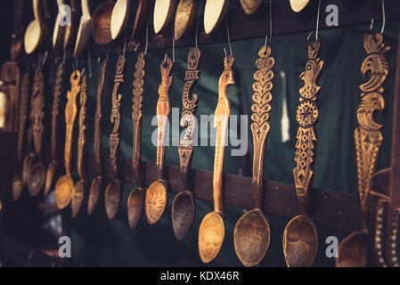 Vintage ornamental wooden spoons hanging in a fair Stock Photo