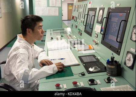 Ship's engineering officer in engine control room Stock Photo