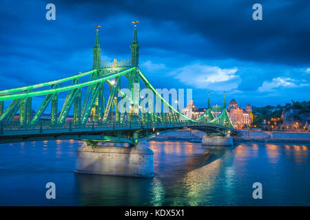 River Danube Budapest, the Szabadsag Bridge illuminated at night spanning the Danube River with the Gellert Hotel in the distance, Budapest, Hungary. Stock Photo