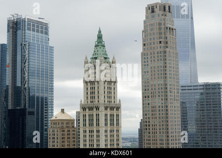 The Woolworth Building, designed by Cass Gilbert, surrounded by some of the other skyscrapers of Lower Manhattan, including 1 World Trade Center. Stock Photo