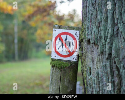 Horse riding prohibited or forbidden sign in black, white, red in forest near Berlin, Germany Stock Photo