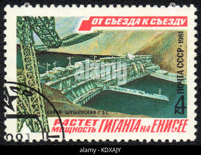 A postage stamp printed in USSR  shows Sayano-Shushenskaya HPP, from series From congress to congress, circa 1981 Stock Photo