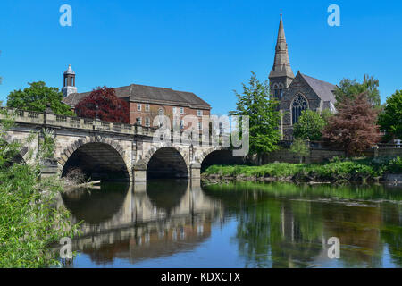 The English Bridge on the River Severn, Shrewsbury, Shropshire, England, UK.  United Reformed Church on the right and the Sixth Form College centre Stock Photo