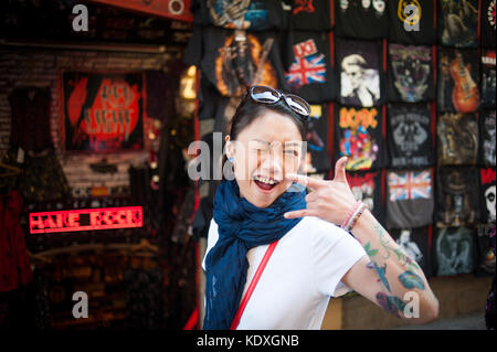 Tattoed girl smiling at camera Stock Photo