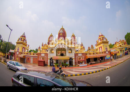 Amer, India - September 26, 2017: Beautiful view of the Laxminarayan Temple, with some motorcycles and cars moving in front, is a temple in Delhi, India Stock Photo