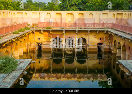 Jaipur, India - September 20, 2017: Old temple reflected in the water, Galta ji Temple Jaipur Rajasthan Stock Photo