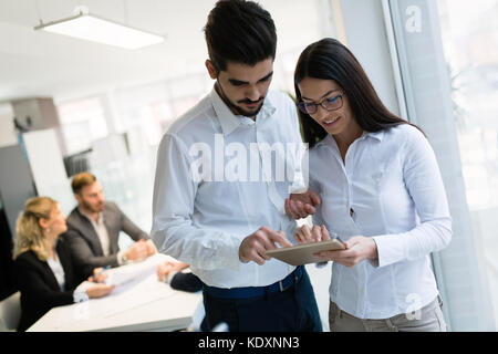 Young attractive architects using digital tablet in office Stock Photo