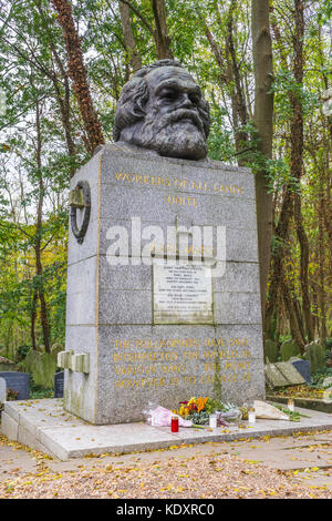 Karl Marx grave in the eastern part of Highgate cemetery featuring a gigantic bust of the revolutionary socialist, London, England, UK Stock Photo