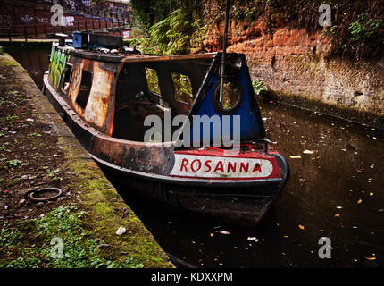 burnt out in Manchester: the wreck of the Rosanna moored on a spur of the Bridgewater Canal Stock Photo