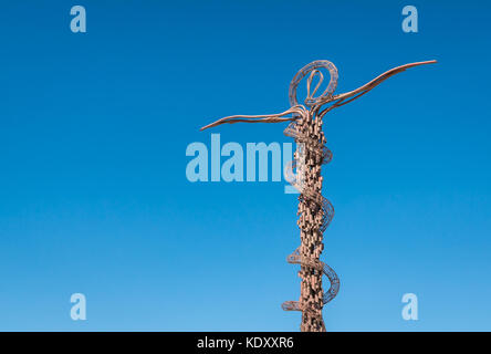 Close up of Brazen Serpent monument cross sculpture by Giovanni Fantoni symbolising bronze serpent created by Moses in wilderness, Mount Nebo, Jordan Stock Photo