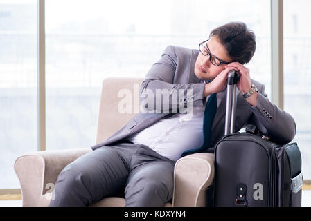 Young businessman in airport business lounge waiting for flight Stock Photo