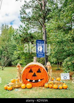 Hay roll decorated for the American Halloween holiday in Pike Road, Alabama USA. Stock Photo