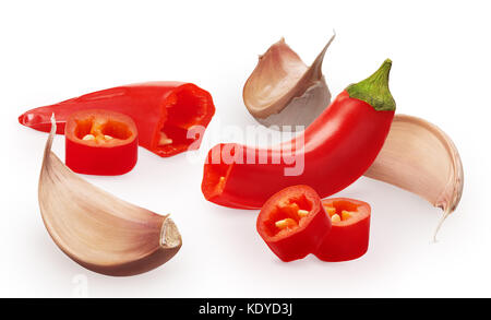 Three cloves of garlic and cut red chili pepper vegetables isolated on white background Stock Photo