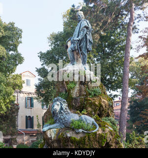 Statue of Giuseppe Garibaldi in the Giardini Pubblici, Castello,  Venice, italy with the Venetian  Lion at his feet, evening light, with light sea mis Stock Photo