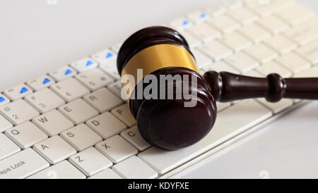 Online auction concept. Auction or judge gavel on a computer keyboard Stock Photo
