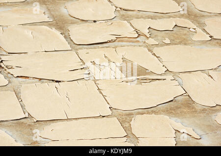 old weathered linoleum tile floor with cracked and broken tiles on concrete Stock Photo