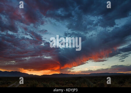 dramatic sunset over the Owens Valley with distant mountains Stock Photo