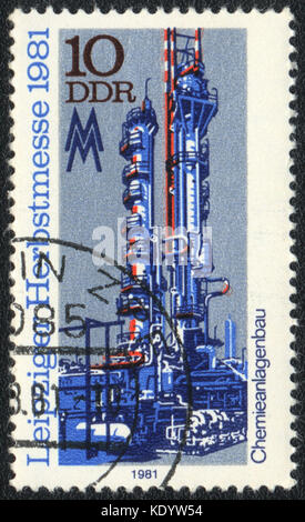 A postage stamp printed in DDR shows chemical machinery on the Austrian Trade Fair, circa 1981