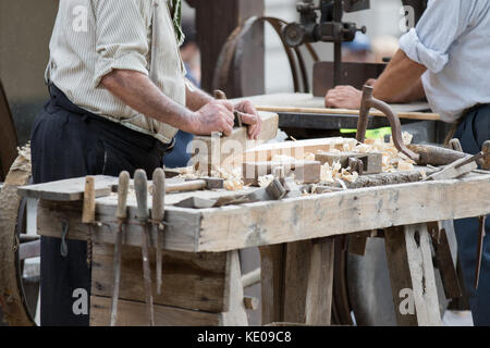Asti, Italy - September 10, 2017: carpenter works wood with its tools Stock Photo
