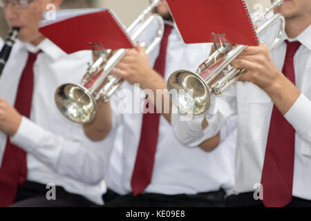 Asti, Italy - September 10, 2017: A couple of trumpets in the hands of trumpeters Stock Photo