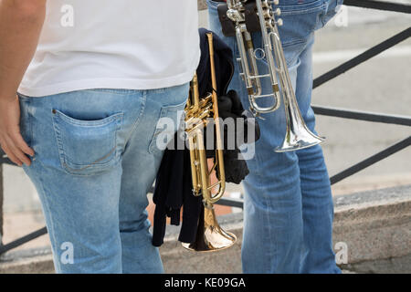 Asti, Italy - September 10, 2017: A couple of trumpets in the hands of trumpeters Stock Photo