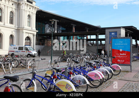 City bikes for hire via an app outside the entrance to the central railway station in Oslo, Norway Stock Photo