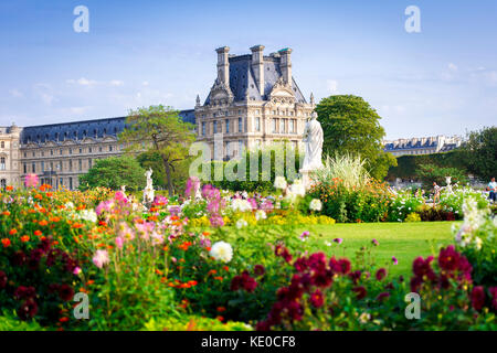 The Jardin des Tuileries (Tuileries Garden), and the beautiful architecture of the Louvre is on display in the background. Paris, France Stock Photo