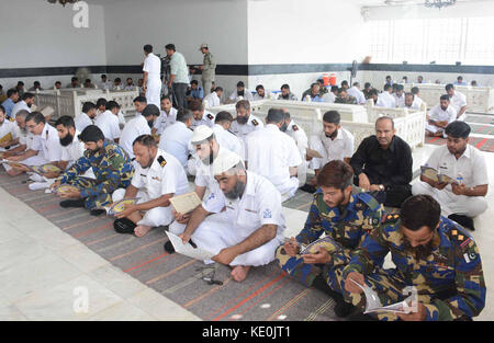 Forces staffs hold recitation of Quran for the peace of departed soul of Liaquat Ali Khan, at his mausoleum in Karachi on Monday, October 16, 2017. The 66th martyrdom anniversary of Pakistan's first Prime Minister Shaheed-e-Millat Khan Liaquat Ali Khan is being observed on Monday, October 16, 2017. Stock Photo