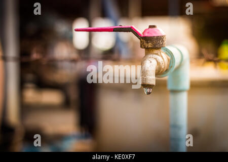 old rusty tap leaking water Stock Photo