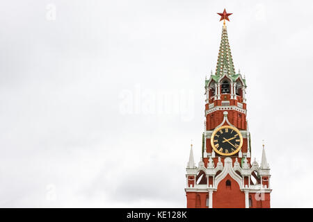 Spasskaya Tower of the Moscow Kremlin against the white sky. Moscow, Russia Stock Photo