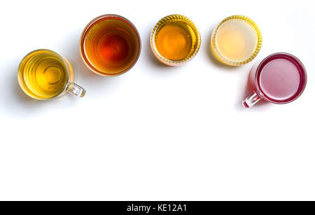 Various herbal teas in glass cups on white background Stock Photo