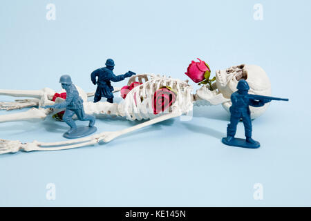Plastic toy Soldiers arround a pop skeleton wearing flower roses on a pop vibrant blue background. Minimal color still life photography Stock Photo