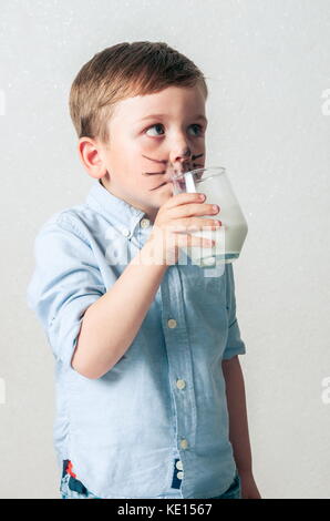 Little boy drinking milk Stock Photo