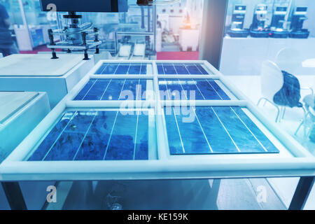 production of solar panels, Industrial robot working in factory,Conveyor Tracking Controler of robotic hand. Stock Photo