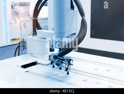 robot with vacuum suckers picks the item from the conveyor in manufacture factory Stock Photo