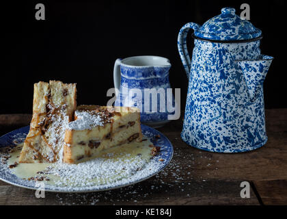 Jumbo french toast stuffed with bananas, roasted pecans and caramel on rustic background Stock Photo