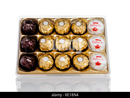 LONDON, UK - FEBRUARY 28, Ferrero Collection Rocher premium chocolate sweets plastic box.On white background with reflection. Stock Photo