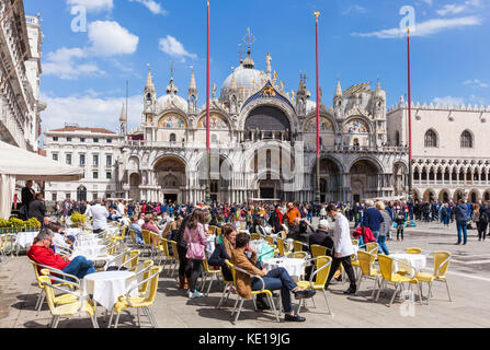 VENICE ITALY VENICE Cafes in St marks Square Piazza san marco in front of the basilica di san marco St. Mark’s Basilica Venice italy EU Europe Stock Photo