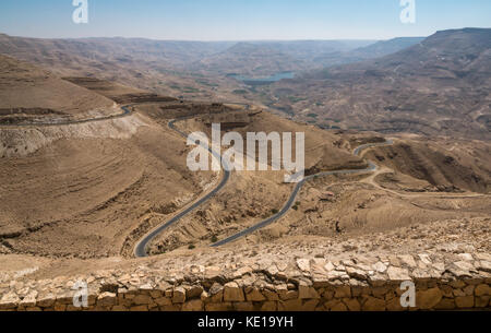Viewpoint on Kings Highway of Wadi Mujib desert valley with an empty winding desert road, Jordan, Middle East Stock Photo